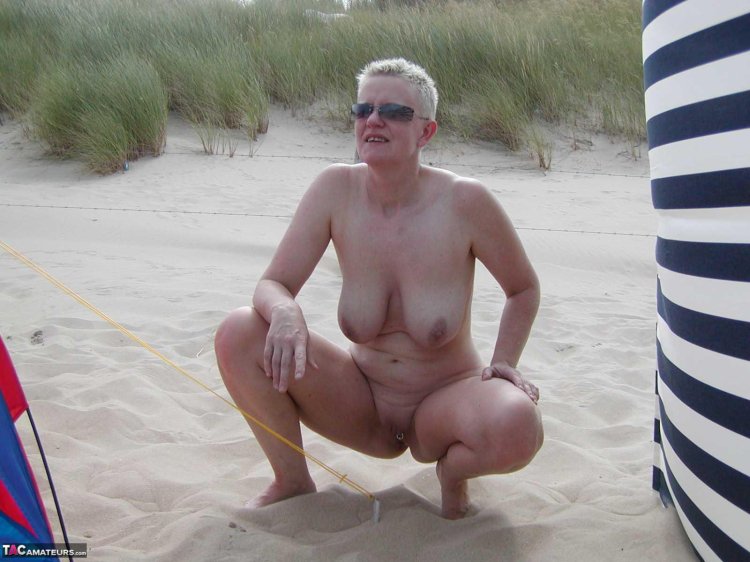 Naked women aged on the beach