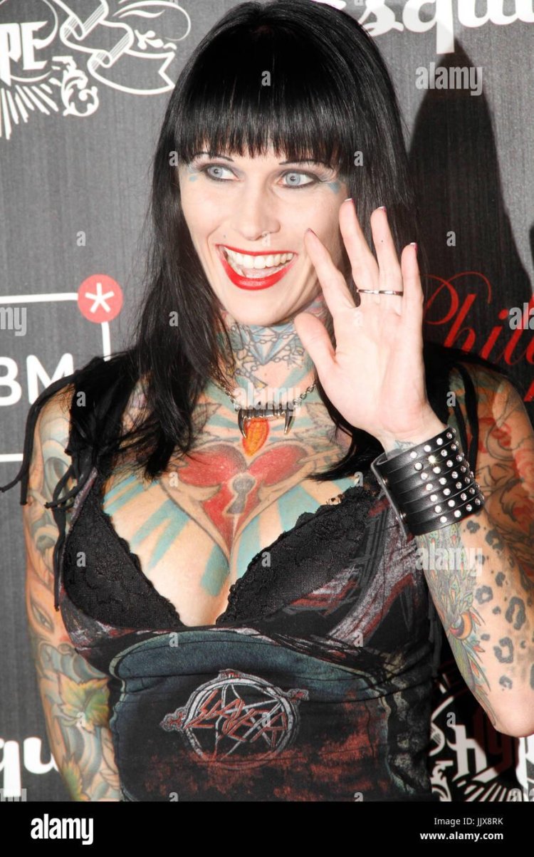 Jennifer Connelli in a black swimsuit