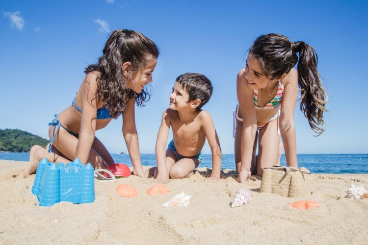 Nudists with children on the beach