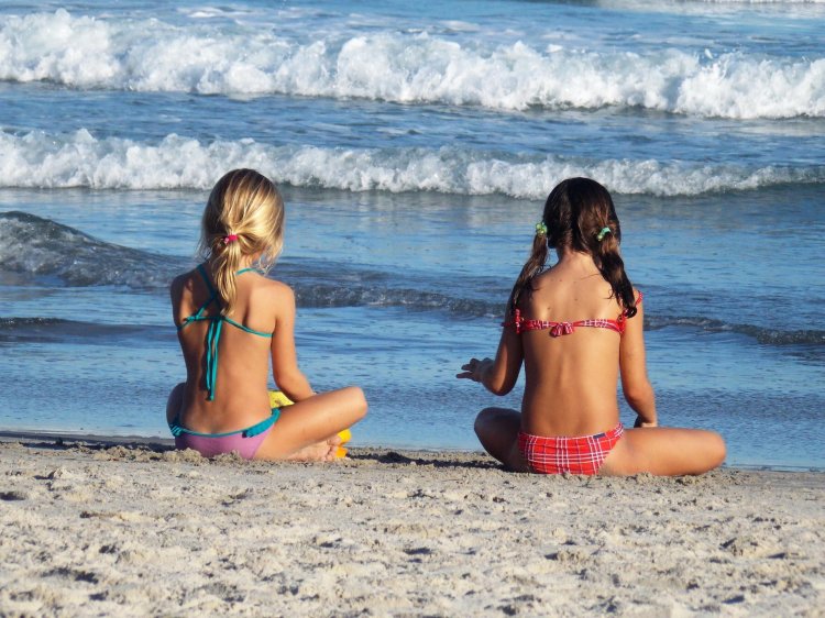 Topless children on the beach