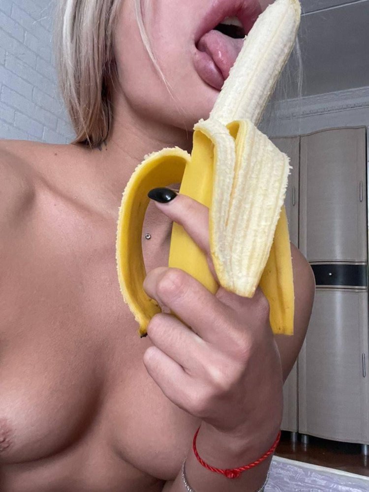 Banana in the mouth of a girl