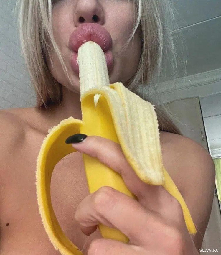 Girl with a banana in her mouth