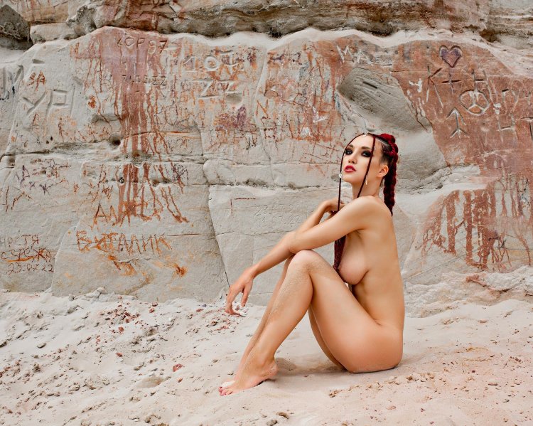 Naked girl in the sand