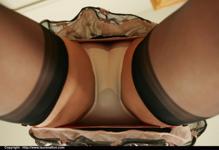 Under a skirt in stockings