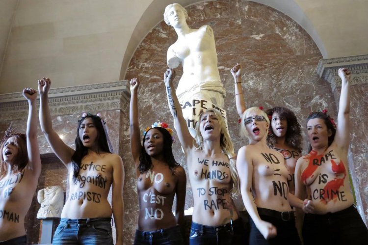 Naked activists in Paris