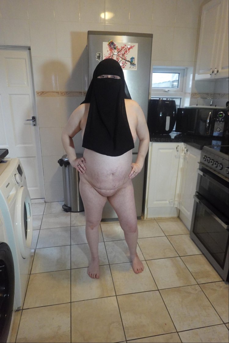 Pregnant wife in muslim niqab and nursing bra