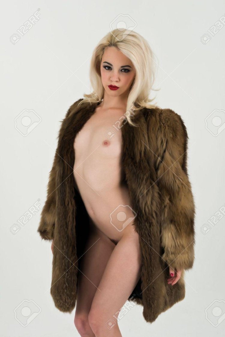 Naked virgins blonde in a fur coat