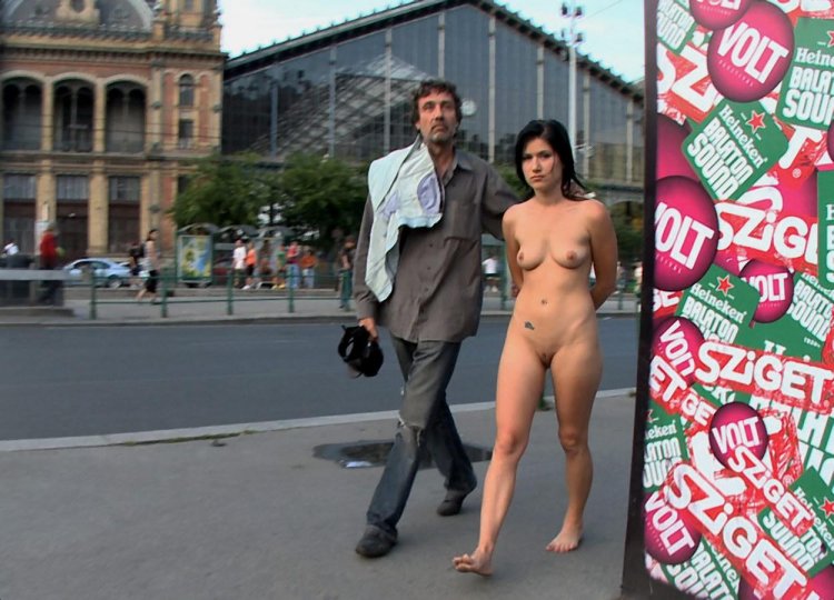 Walks naked along the street