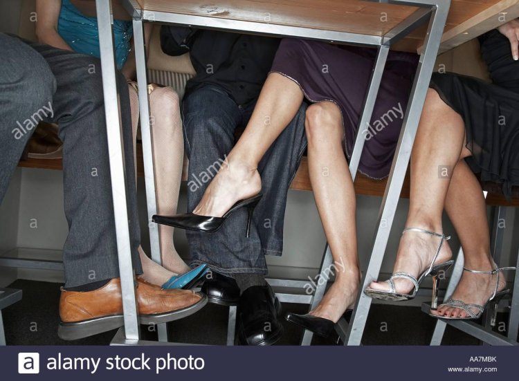 Legs under table