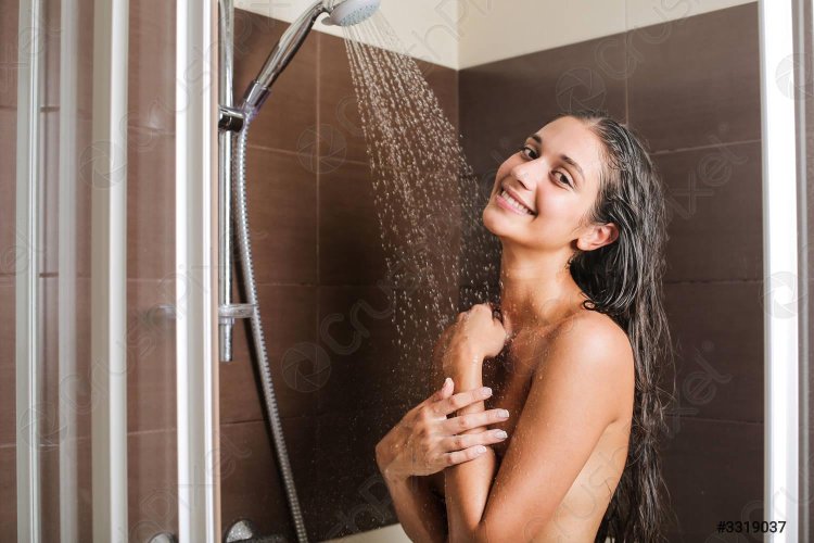 Young beautiful woman in a shower