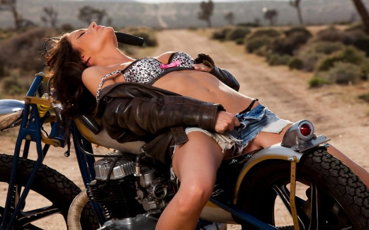 Erotic photo shoot with a motorcycle