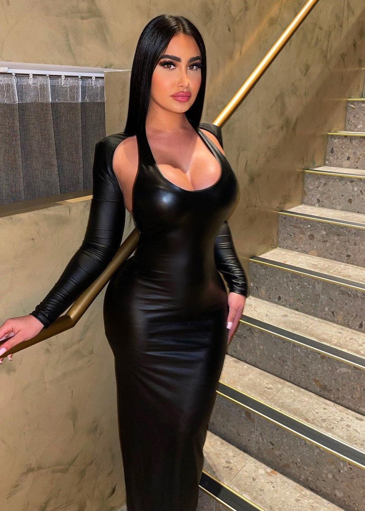 Female tight -fitting dress made of artificial leather