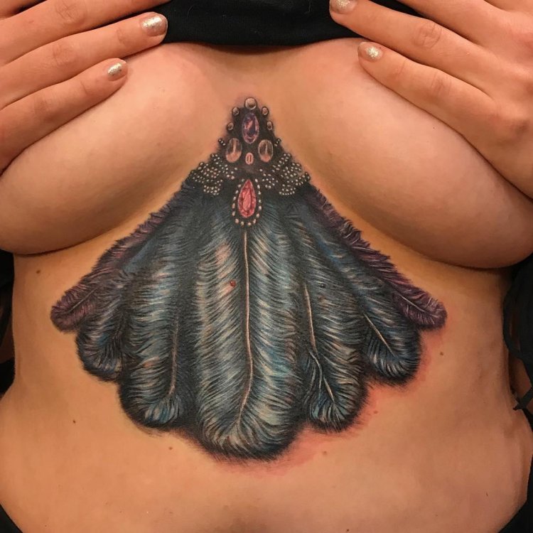 Tattoo on the sternum of female