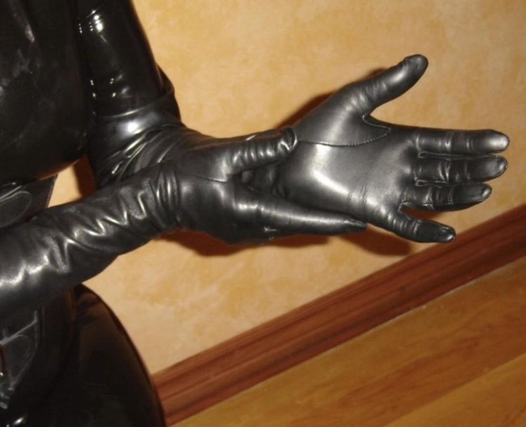 Fetish in leather gloves