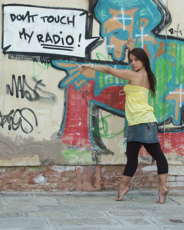 Girl against the background of graffiti