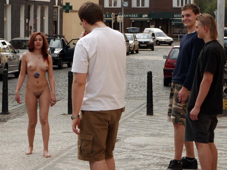 Walks naked along the street