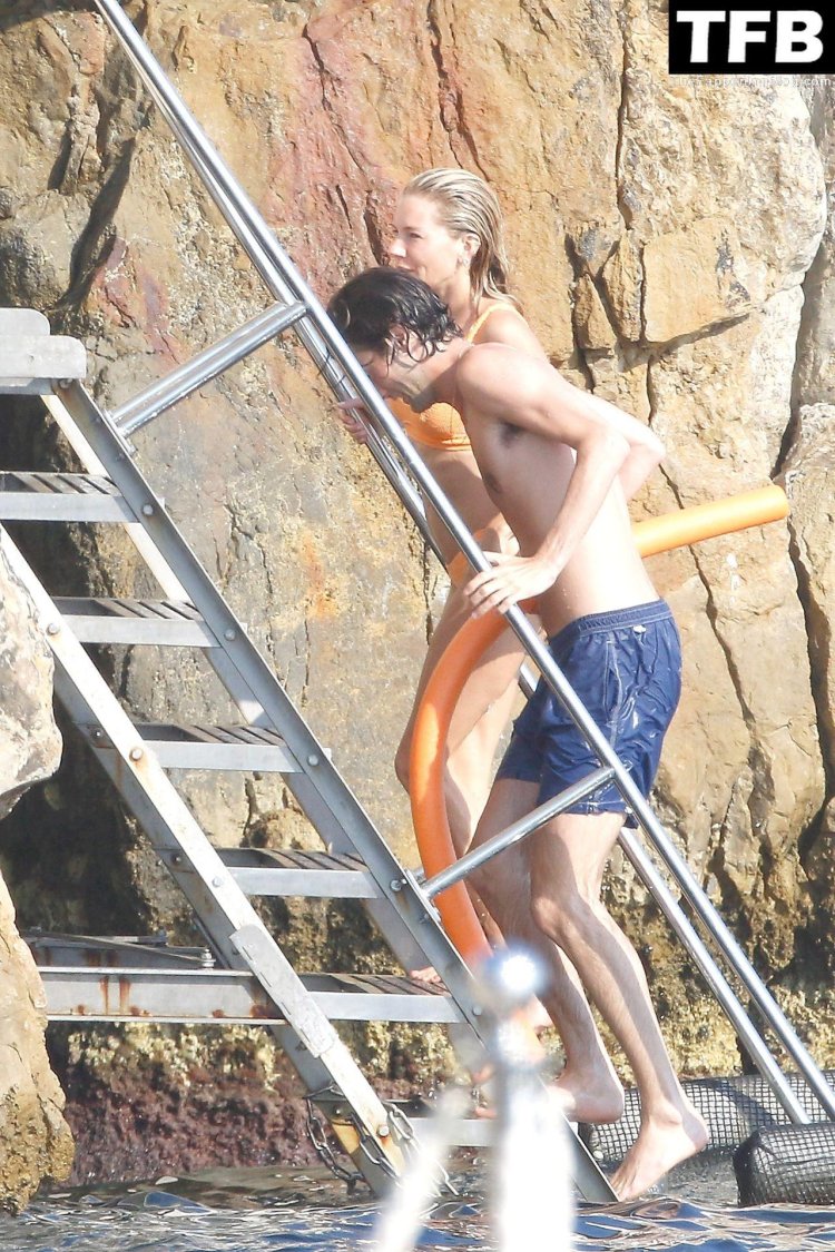 Sienna Miller on the beach