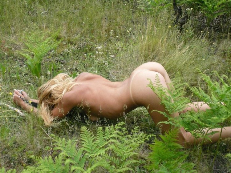 Woman with a crustacean in nature naked