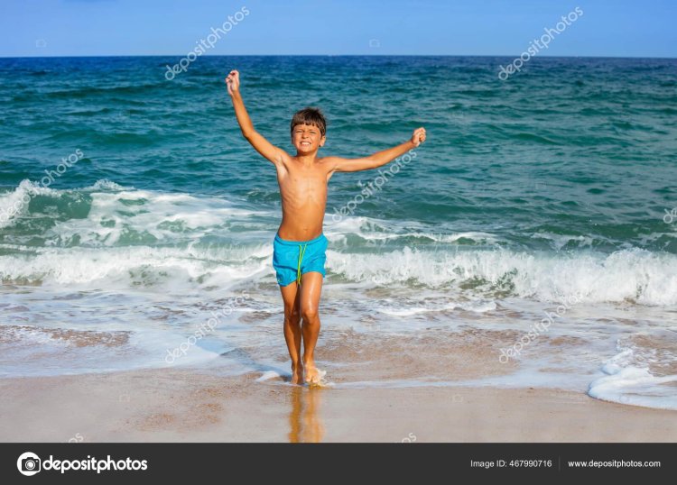 Naked boy on the beach
