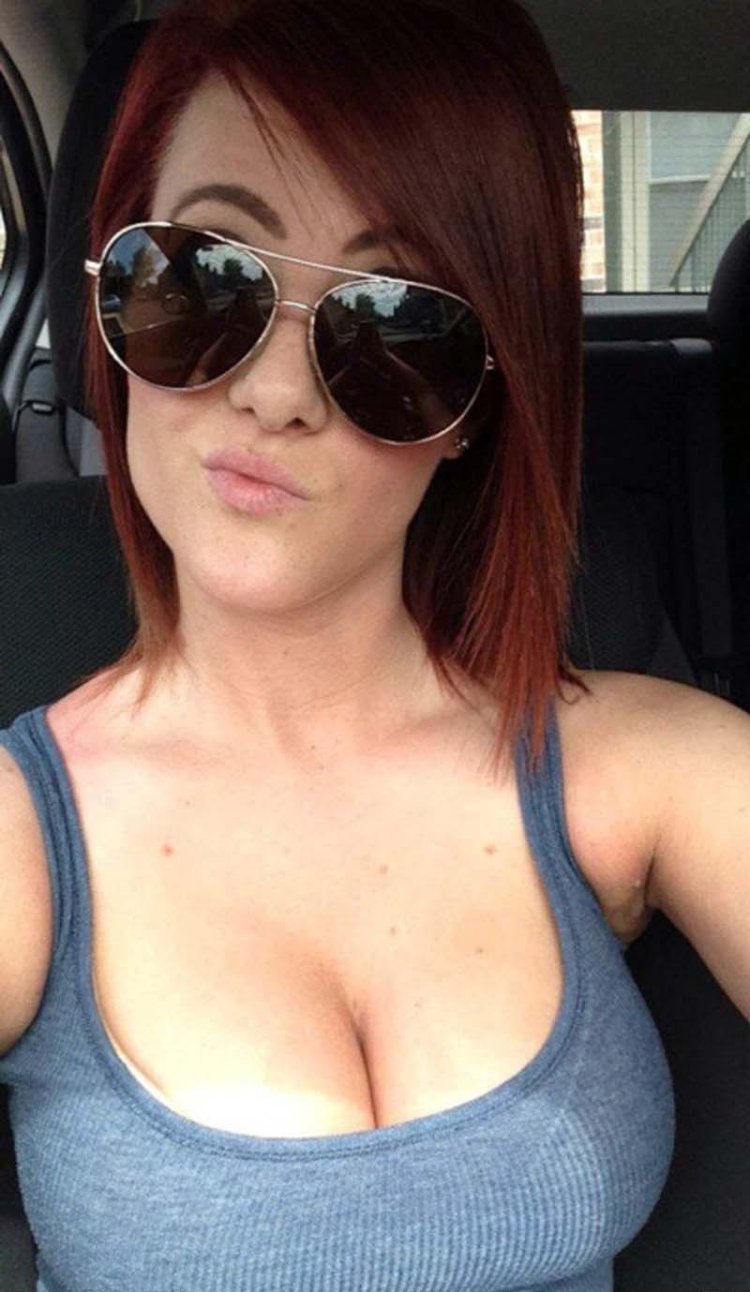 Red -haired girl with big breasts