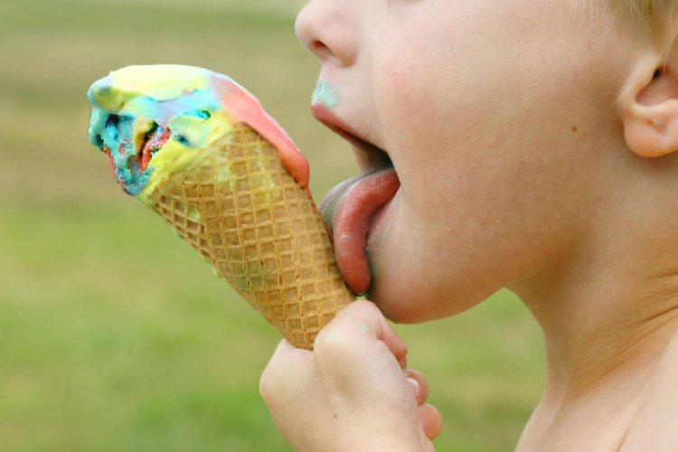 Girl licks ice cream