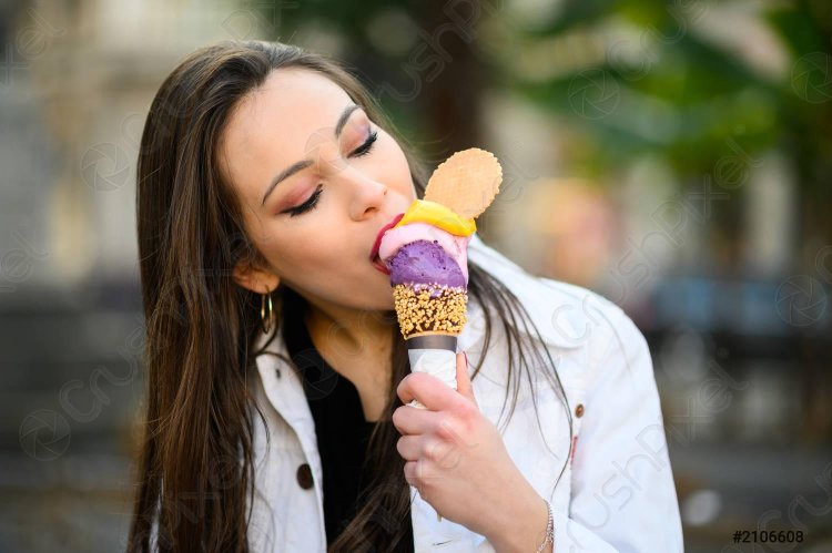 Girl licks ice cream