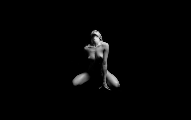 Naked girls on black background
