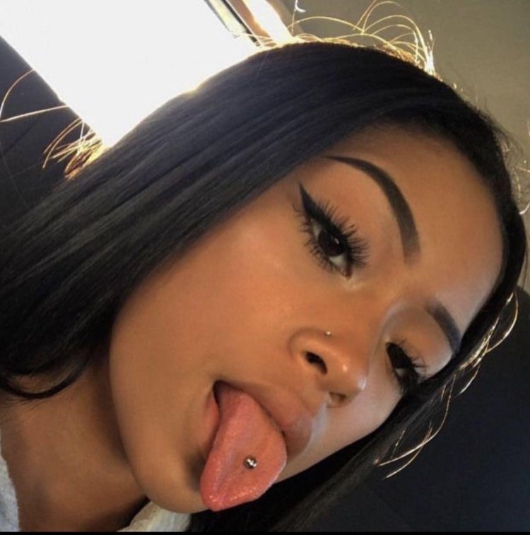 Beautiful piercing of the tongue in girls