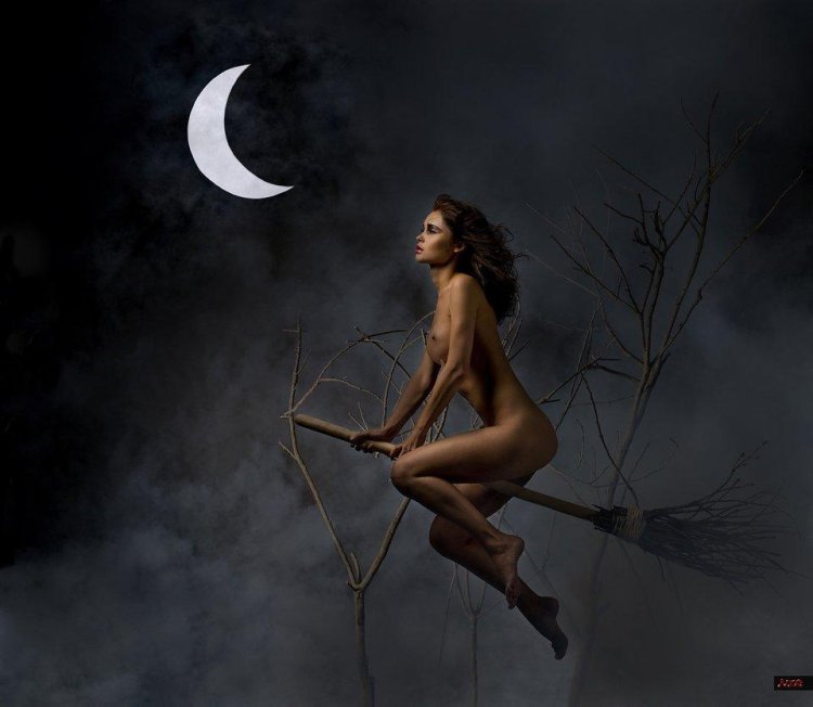 Naked witch on a broomstick