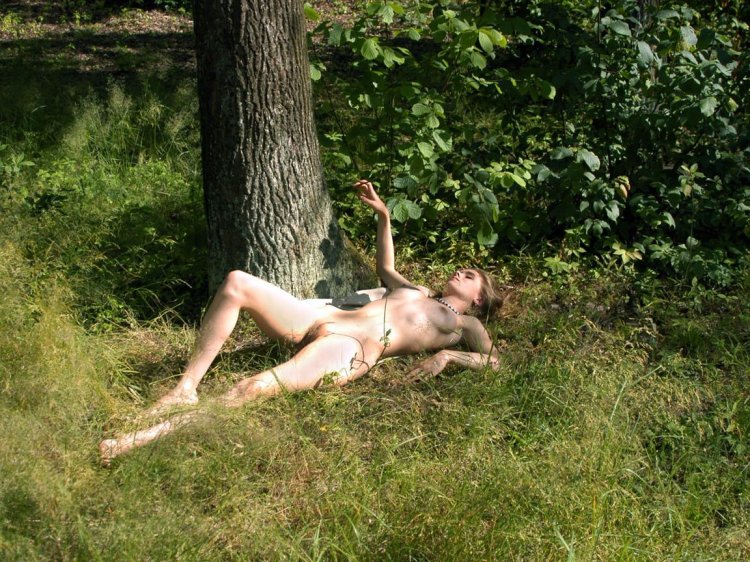 Naked women lying in the forest