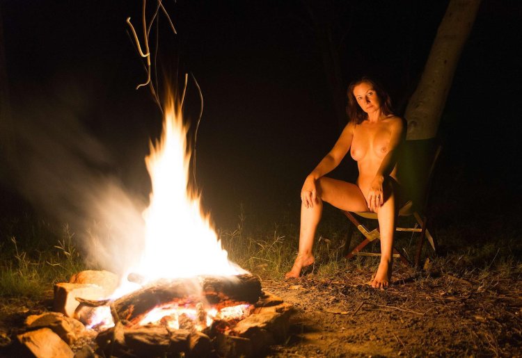 Erotic photo shoot by the fire