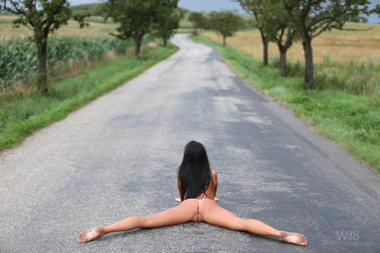 Naked woman on the asphalt