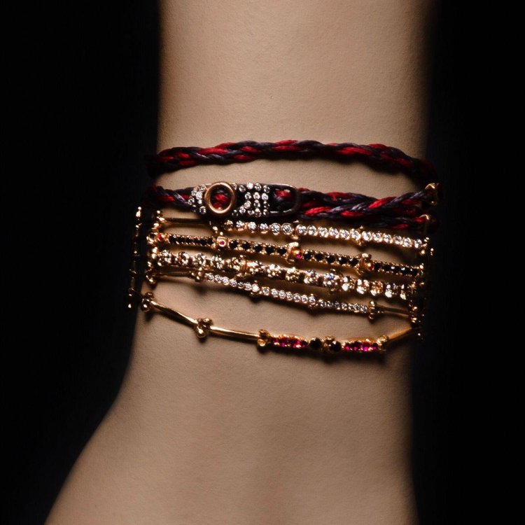 A lot of bracelets on the arm