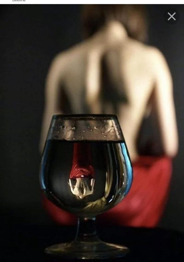 A woman with glass of wine