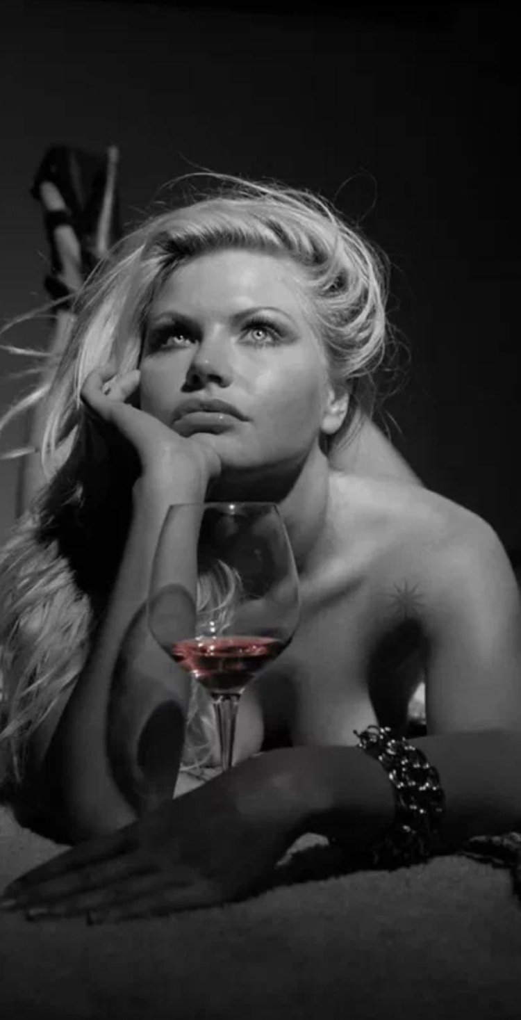 Blonde with a glass of wine