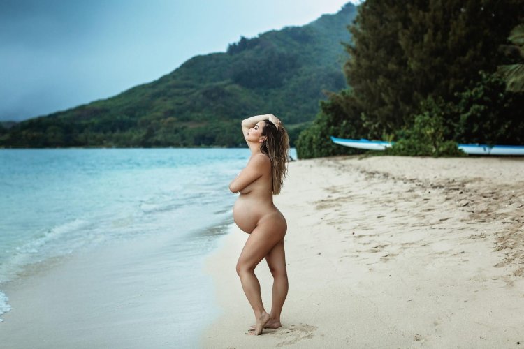 Pregnant on a nudic beach