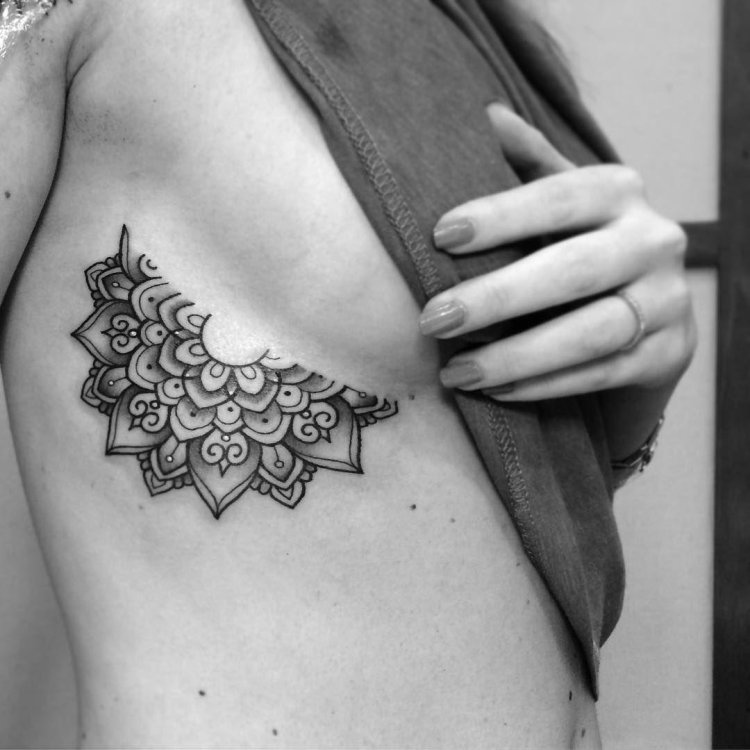 Tattoo mandala on the ribs
