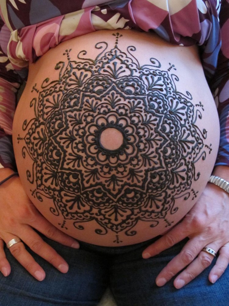 Tattoo mandala on the stomach