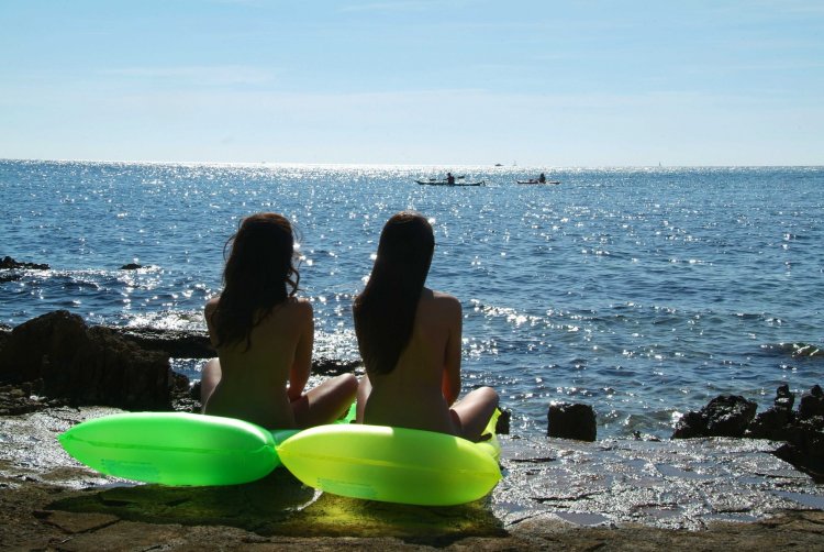 Girls on the beach without top