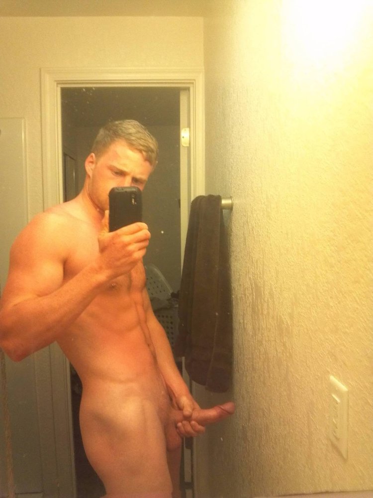 Naked man in front of the mirror