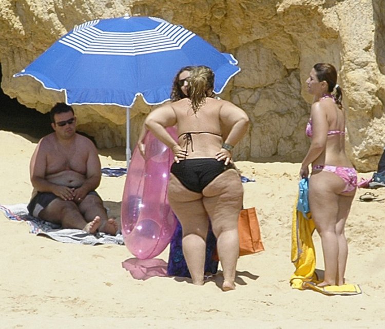 Fat women in thongs on the beach