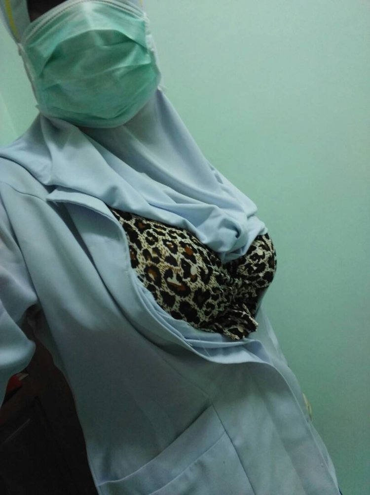 In a hijab, a bra