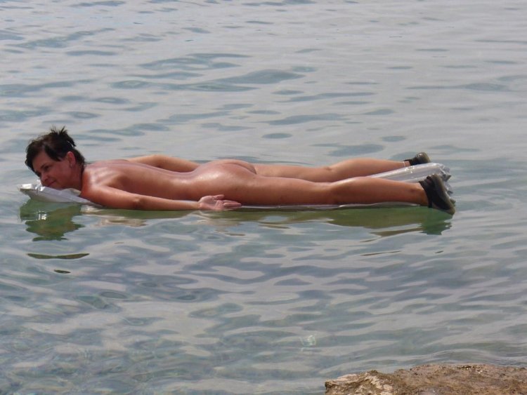 Naked swimming and sunbathing