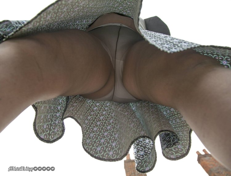 Torn tights under the skirt