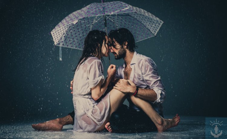 Boy and girl in the rain