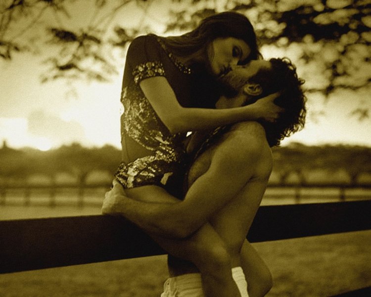 A man passionately hugs a girl