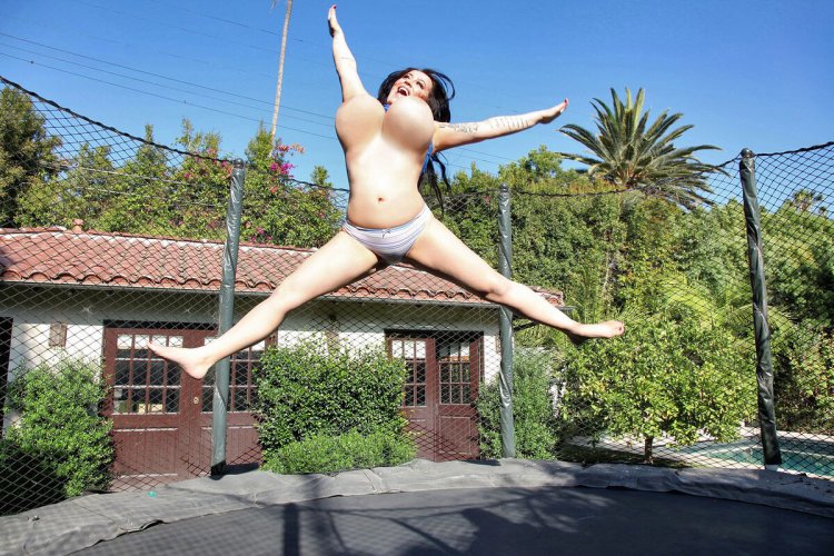 Jumps naked on a trampoline