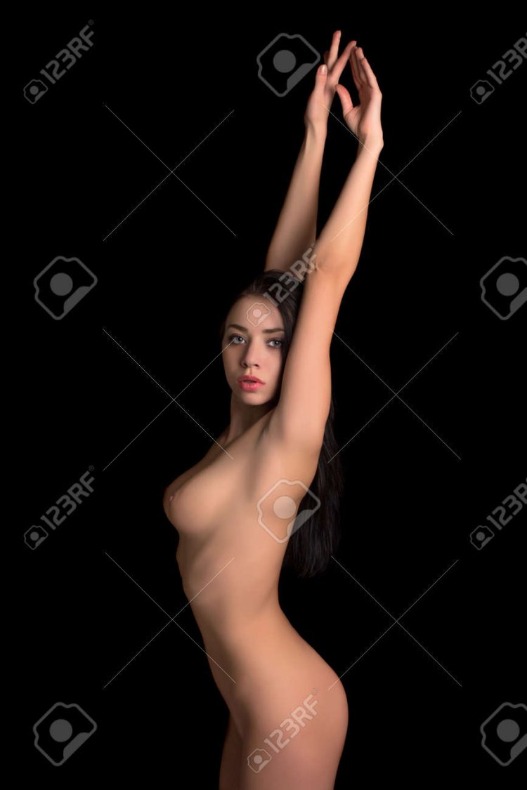 Girl with raised arms and boobs