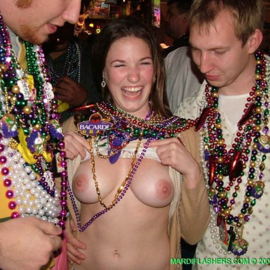 Women showing breasts by beads