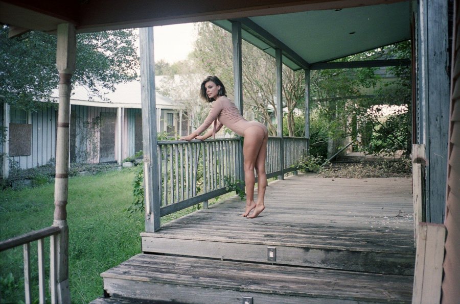 Naked girl on the porch